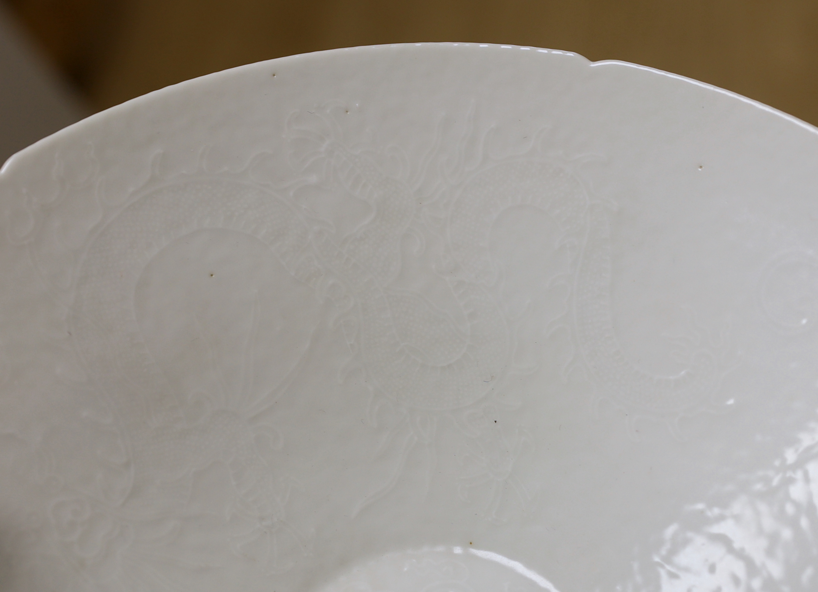 A Chinese white Anhua decorated conical dish, 20cm